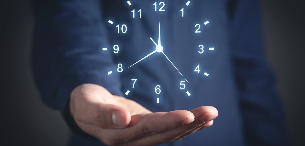 caucasian businessman showing clock time management